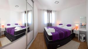 Postel nebo postele na pokoji v ubytování Apartments Diamond + 23 fotografií