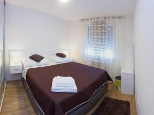Ein Bett oder Betten in einem Zimmer der Unterkunft Apartments Diamond