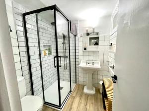 a bathroom with a shower and a sink at Apto Bakio a pie de playa in Bakio +15 photos