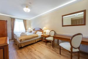 Posteľ alebo postele v izbe v ubytovaní Zámeček - Chateau Lány - Depandance Stroodel