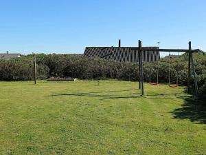 an open field with a goal in the grass at 8 person holiday home in Harbo re in Harboør
