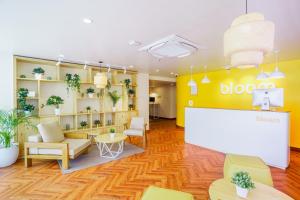 a reception area of a doctor office with a whiteboard at Bloom Hotel - Cyber Towers in Hyderabad