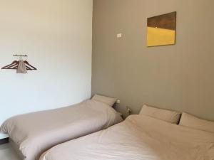 Postel nebo postele na pokoji v ubytování White Cat B&B