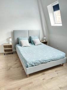 En eller flere senge i et værelse på Cosy Duplex - Wifi - Tv - 2 Chambres