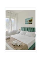 a bedroom with a large bed with two towels on it at Casa Vacanze Imma in Sorrento