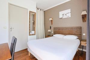 Postel nebo postele na pokoji v ubytování Hôtel François d'O