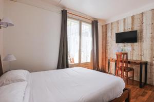 Postel nebo postele na pokoji v ubytování Hôtel François d'O