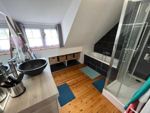 a bathroom with a shower and a sink and a tub at Le nid in Le Pouliguen +19 photos