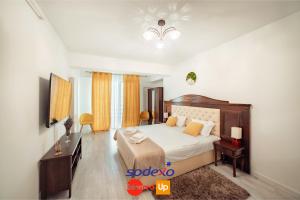 Un pat sau paturi într-o cameră la LUXURY Cozy Apartments and Studios Palas Mall Iasi