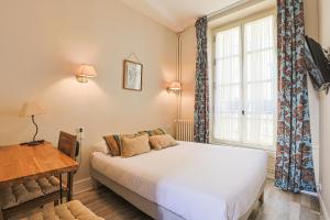 Postel nebo postele na pokoji v ubytování Hôtel François d'O