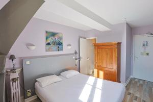 Postel nebo postele na pokoji v ubytování Hôtel François d'O