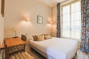 Postel nebo postele na pokoji v ubytování Hôtel François d'O