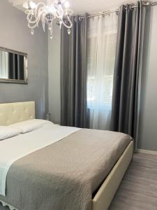 Postel nebo postele na pokoji v ubytování Casa Rosmini rooms, Dolomia best home