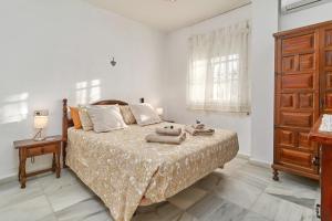 Postel nebo postele na pokoji v ubytování Jardines del Mar
