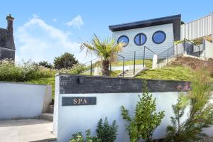 a sign that reads spa in front of a building at Turnstone in Torpoint