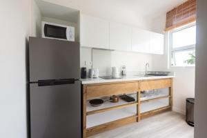 Кухня или мини-кухня в Dodo Square Residence
