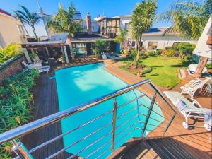 a view from the balcony of a house with a swimming pool at Blue View B&B in East London