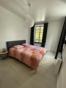 Ένα ή περισσότερα κρεβάτια σε δωμάτιο στο Appartement Le Petit Charcot