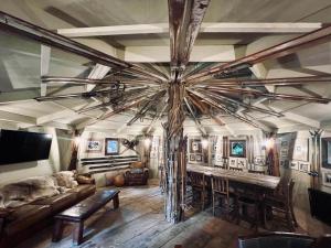 a living room with a large wooden ceiling at Luxury Airstream Retreat in Tonbridge