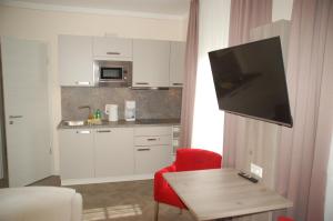 Η κουζίνα ή μικρή κουζίνα στο Aparthotel Weißenhorn +5 φωτογραφίες