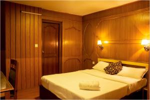 Postel nebo postele na pokoji v ubytování Nag Pukhu Guest House