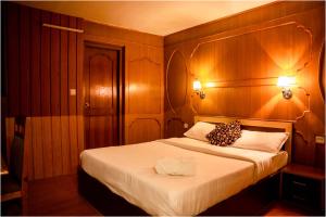 Postel nebo postele na pokoji v ubytování Nag Pukhu Guest House