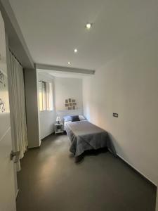 En eller flere senge i et værelse på Apartamento La Marquesa