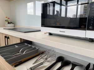 谷園酒店公寓Good Garden Apartment電視和／或娛樂中心
