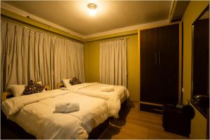 Postel nebo postele na pokoji v ubytování Nag Pukhu Guest House