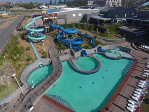 an aerial view of a water park with a water slide at Blaasoppie 202 in Mossel Bay