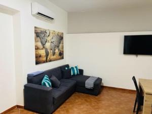 TV a/nebo společenská místnost v ubytování Casa Abignenti