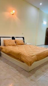 Posteľ alebo postele v izbe v ubytovaní Sophia Homestay PP