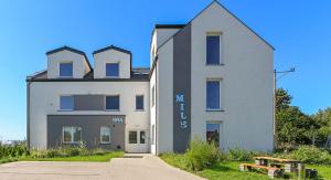 a white building with the words my house on it at Mile Gdansk Airport in Gdańsk