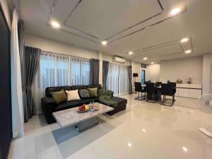 a living room with a couch and a table at Bangna 4bedroom new house luxurious discount now in Bangkok