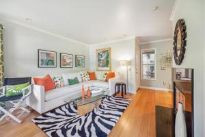 a living room with a zebra patterned rug at Monarch Beach - Gated Community - 1 Bed King in Dana Point