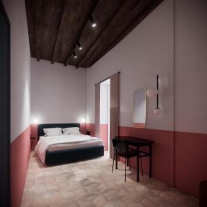 ローマにあるUnoUnOttoのベッドルーム1室(ベッド1台、テーブル、椅子付)