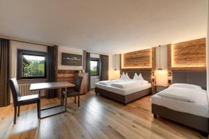 Monte Pana Dolomites Hotel客房内的一张或多张床位