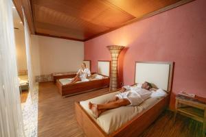 Monte Pana Dolomites Hotel客房内的一张或多张床位