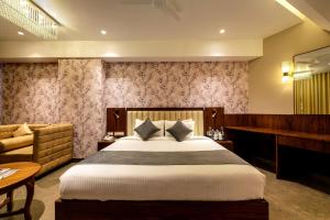 Rúm í herbergi á Sundex Hotel