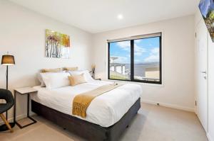 Ένα ή περισσότερα κρεβάτια σε δωμάτιο στο Oceana B&B