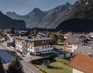 an aerial view of a town with mountains in the background at A Casa Elegance in Längenfeld