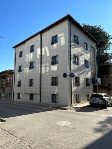 a white building with a car parked in front of it at Vera Edirne in Edirne