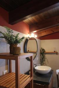 a bathroom with a sink and a mirror at Casa rural 3R in Don Álvaro