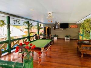 a billiard room with a pool table in it at Lakefront Tree Escape in Buriram, Thailand in Buriram