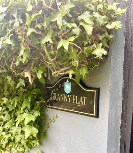 a sign that says cranky hat hanging on a wall at The Waters Country House in Ballyvaughan