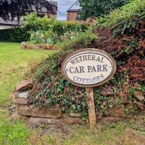 a sign for a car park in a yard at Wetheral Cottages Package 1 in Great Salkeld