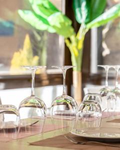 a group of wine glasses sitting on a table at Hotel Aroi Bierzo Plaza in Ponferrada