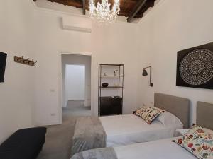 A bed or beds in a room at La tua casa a Piazza del Popolo