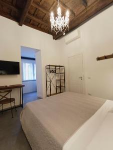 A bed or beds in a room at La tua casa a Piazza del Popolo