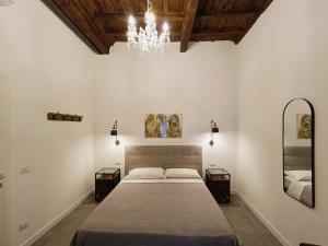 A bed or beds in a room at La tua casa a Piazza del Popolo
